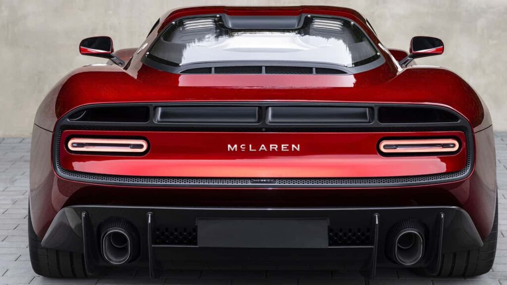 Rear view of a red McLaren showing the new McLaren wordmark